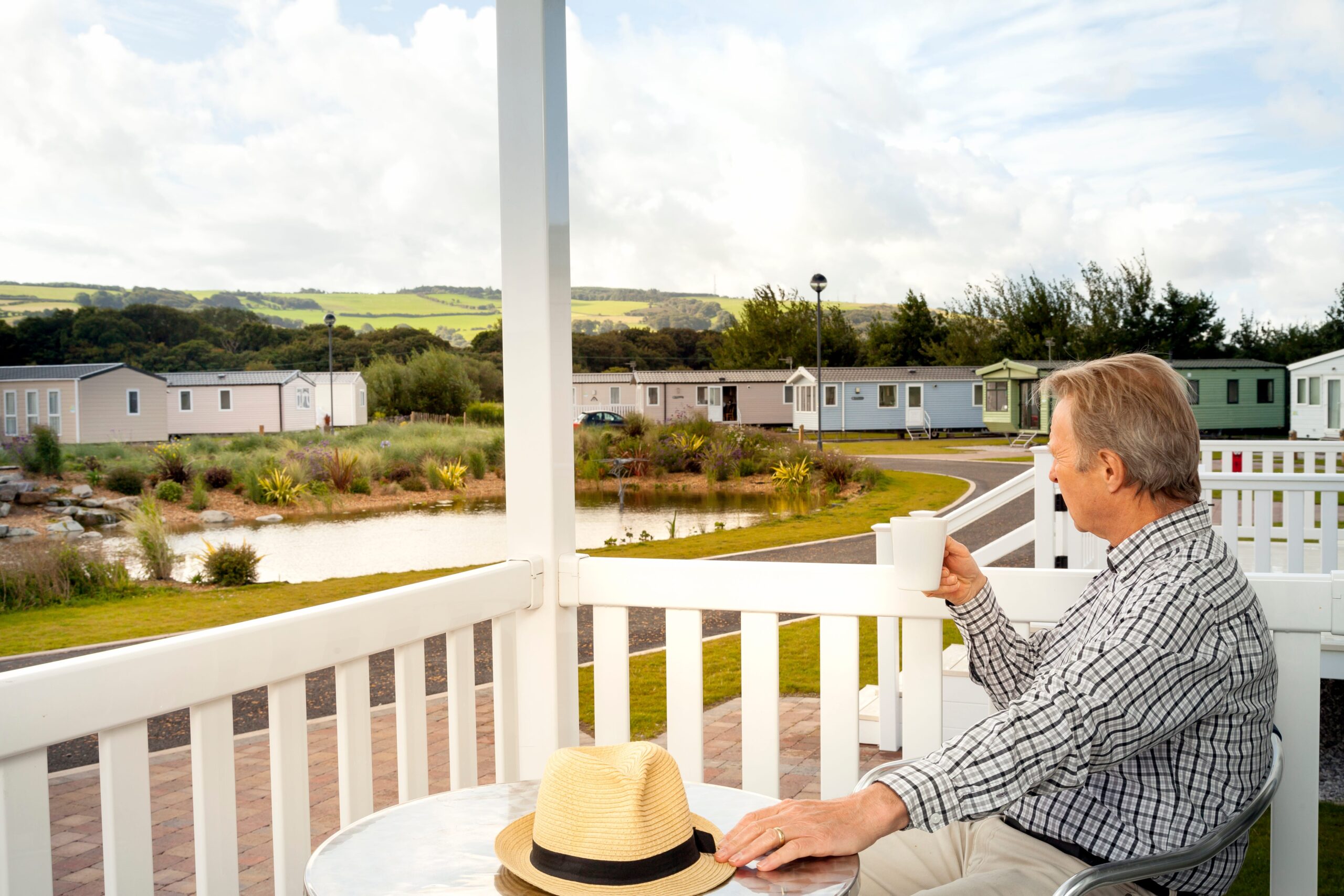 Man sat on porch of static caravan